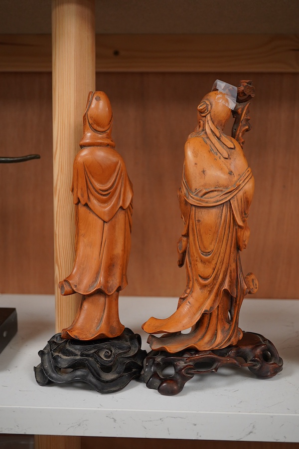 Two Chinese carved boxwood figures, one of Shao Lao, the other of Guan Yin, both on stands, on stands. tallest 26cm